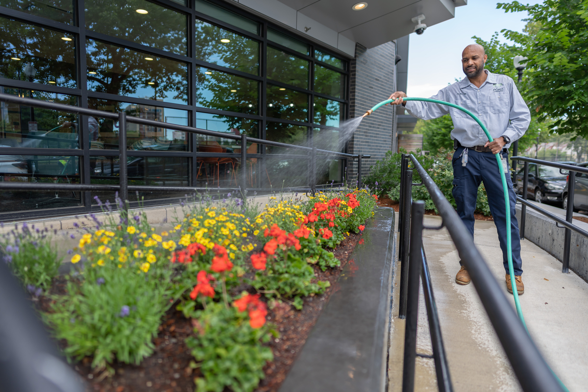 Man watering flowers