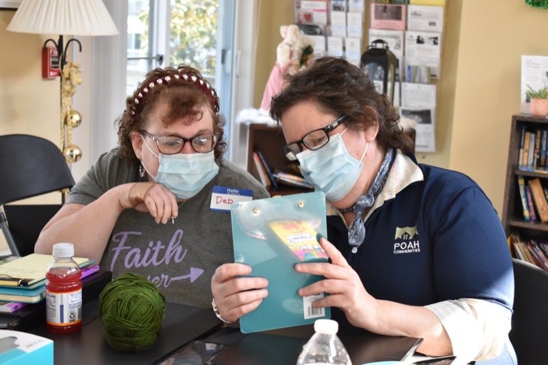 Two women reviewing a document